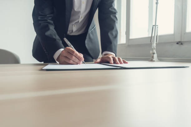 istock Retro image of a lawyer signing testament 1058816908