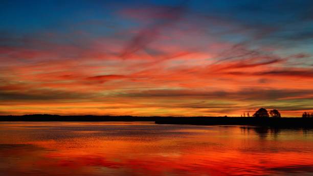 istock Colorful sunrise on a lake 1058818622