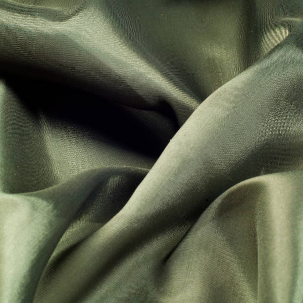 istock Fabric color of olives. olivaceous.  texture 1058819224