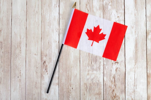 Flag of Canada on a wooden table top
