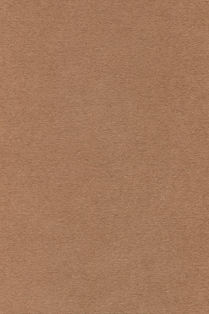 istock Coarse Grain Striped Brown Kraft Paper Coarse Background Texture Sample 1058821814