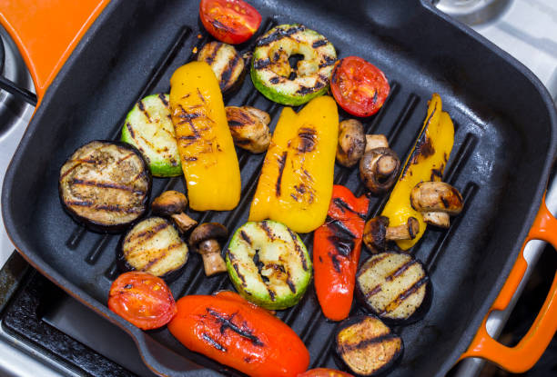 istock Cooking vegetables and mushrooms 1058824050