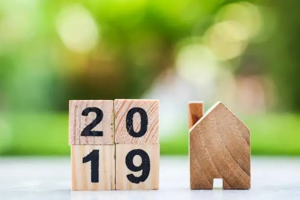2019 wooden block number with wooden house. Using for Happy new year 2019 , business and property concept.