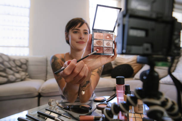 istock Beauty influencer recording content for online vlog 1058828772