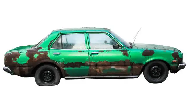 Photo of Isolate side of the car, the color of Green, which crashed with another car until it was demolished.