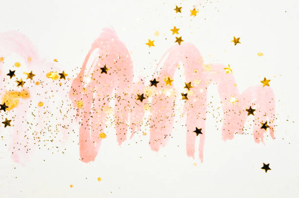 golden glitter and glittering stars on abstract pink watercolor splashes in vintage nostalgic colors. - 5600 imagens e fotografias de stock