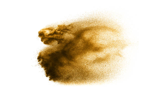 istock Dry river sand explosion. Golden colored sand splash against white background. 1058832044