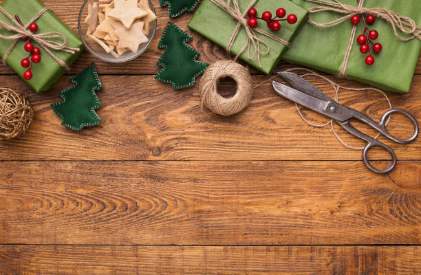 istock Craft Christmas presents on wooden table, copy space 1058832146