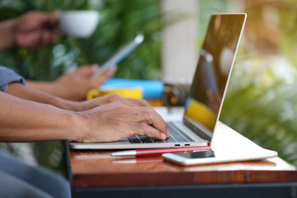 istock Business man of freelancer working using laptop computer in home office, Communication technology and Business concept 1058832654