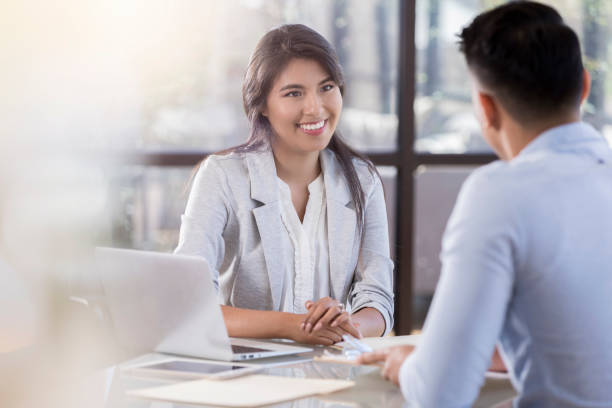 istock Young associates plan during a face to face meeting 1058833144