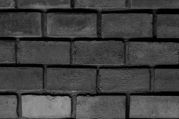 istock dark gray sepia background brick symmetrical row rectangular stone with cement seams multichrome base design loft 1058833602