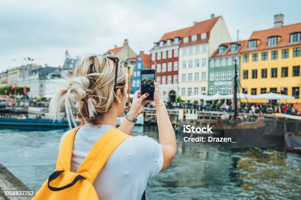 Traveling To Copenhagen Tourist In Nyhavn Stock Photo - Download Image Now - Copenhagen, Tourist, Travel