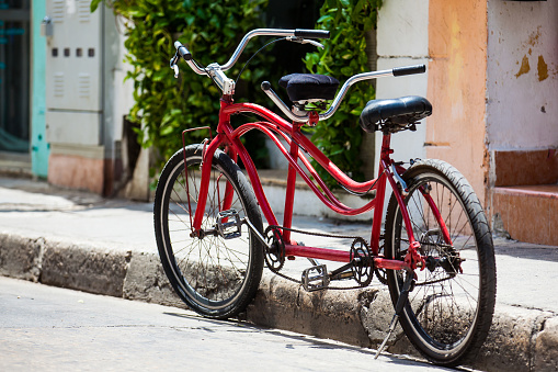 Tandem bicycle parked at the beautiful streets of the walled city in Cartagena de Indias