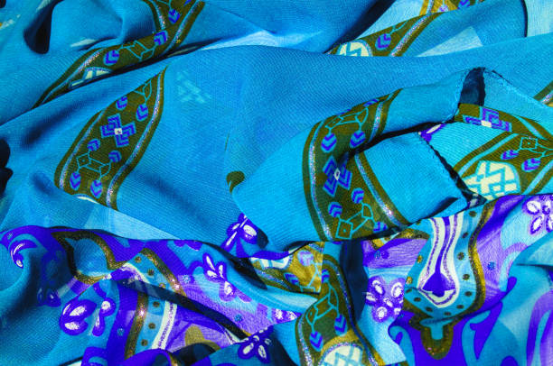background texture blue silk fabric with a pattern. this light silk braided can be turned into your design. with the help of several segments from this print, you can get precious samples of your work - 15828 imagens e fotografias de stock