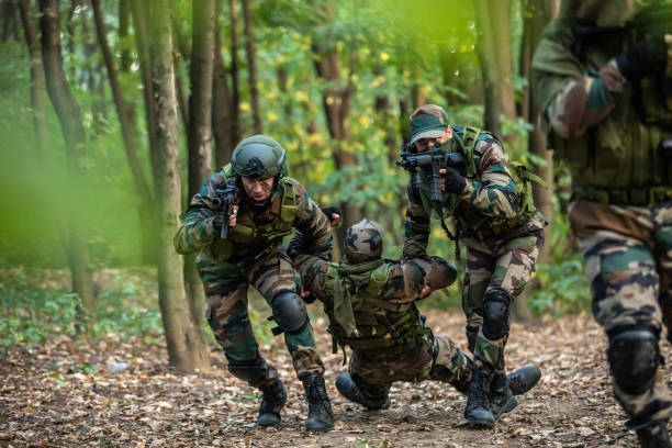 istock Soldiers helping out to wounded friend 1058840078