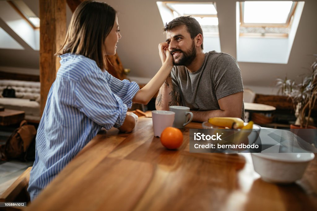 Nothing but love Young couple drinking first morning coffee at home Adult Stock Photo