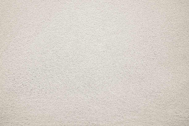 istock White pastel rough crack cement texture stone concrete,rock plastered stucco wall; 1058841310