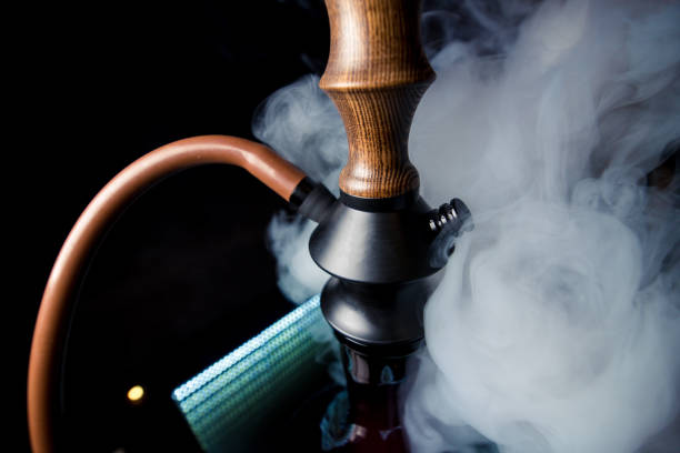 istock beautiful brown-black hookah in smoke 1058843182