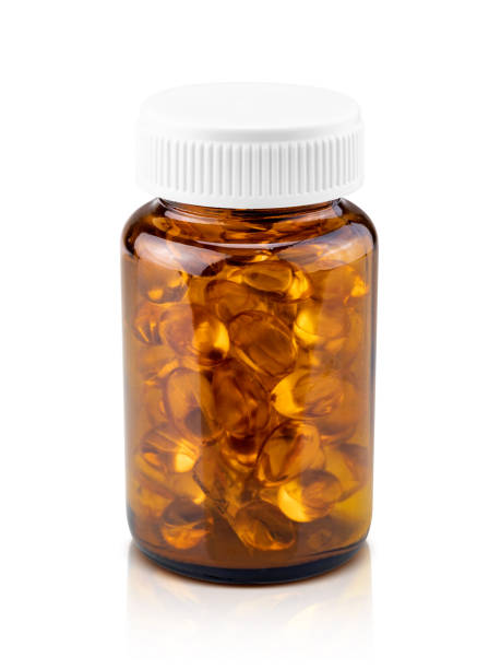 魚の油は茶色のガラス瓶の中の栄養補助食品カプセル - nutritional supplement fish oil vitamin pill bottle ストックフォトと画像