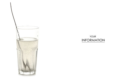 A glass of salt of soda for rinsing teeth pattern on a white background isolation