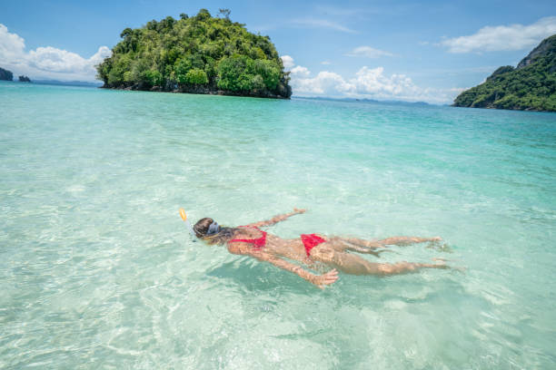 istock Snorkelling girl in Thailand 1058854112