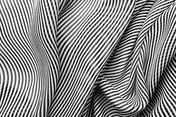 istock Black and white striped pattern of silk, elegant fabric for backgrounds 1058856368