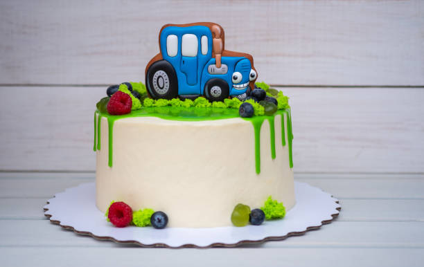 istock birthday cake for a child with a toy tractor 1058856622