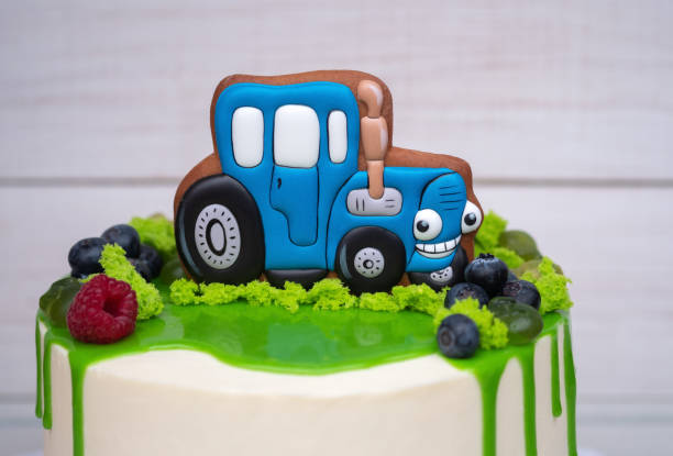 istock birthday cake for a child with a toy tractor 1058856624