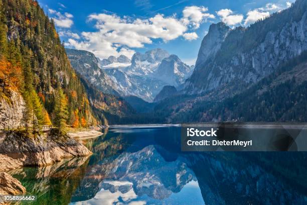 View Of Idyllic Colorful Autumn Scenery With Dachstein Mountain At Lake Gosau Stock Photo - Download Image Now