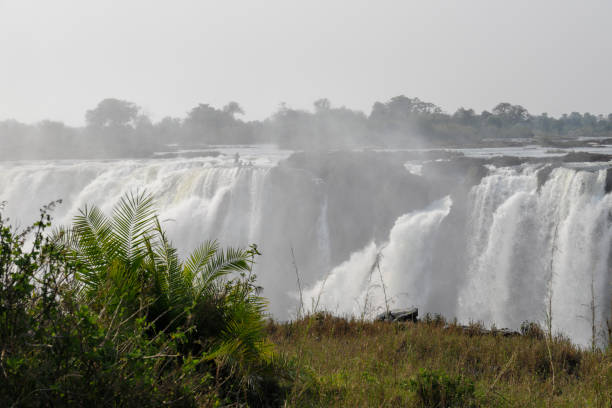istock Misty smoke that thunders Victoria Falls ravine Zimbabwe 1058859768