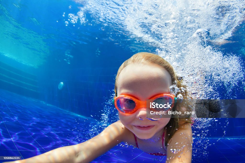 Funny Child In Goggles Dive In Pool Stock - Download Now - Swimming, Child, Swimming Pool - iStock