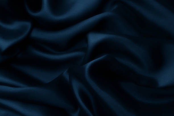 istock Blue satin silk, elegant fabric for backgrounds 1058863644