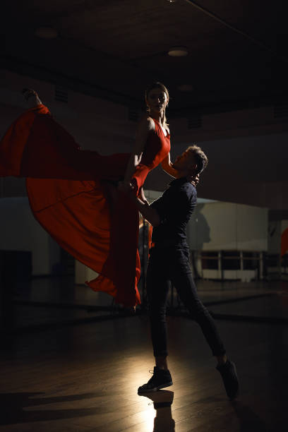 istock Passion dance couple, woman jumping 1058863838