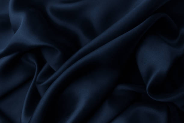 istock Blue satin silk, elegant fabric for backgrounds 1058864044