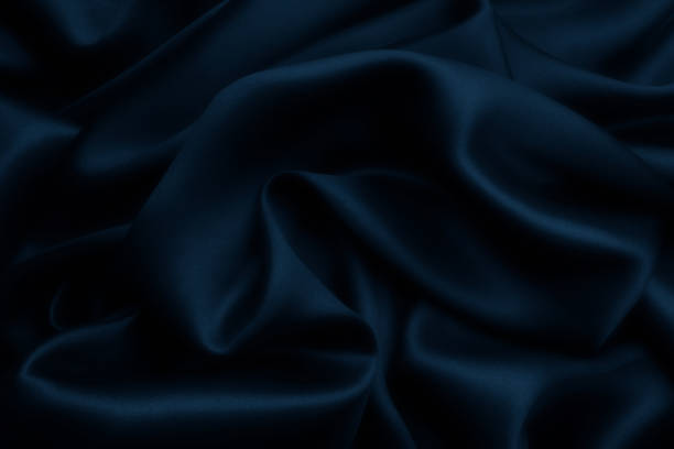 istock Blue satin silk, elegant fabric for backgrounds 1058864364