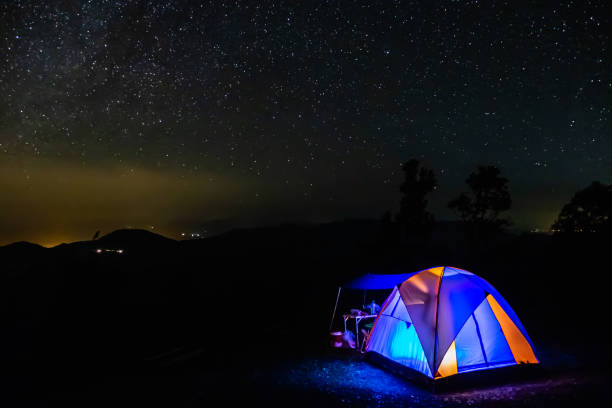 istock camping tent in the night mountain under a starry sky 1058864366