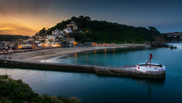 istock View over Looe Harbour at Sunset, the Banjo Pier 1058864532