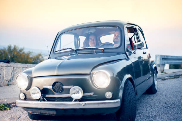 istock Joyful young couple smiling while riding in car 1058867830