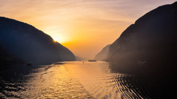 istock Sun rises over the Xiling Gorge and Yangtze River - Yichang, China 1058868630