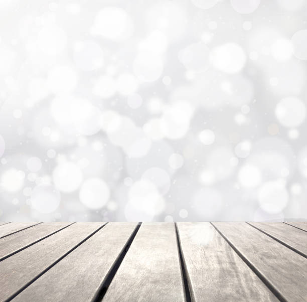 istock Snow bokeh and wooden plank 1058874978