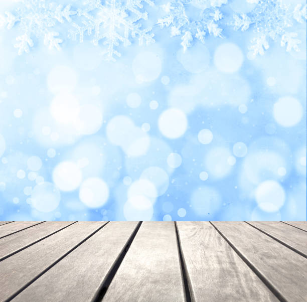 istock Blue Christmas bokeh and wooden plank 1058875006