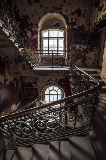 istock Decaying staircase in an abandoned house 1058875334