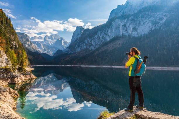 istock Photographer at Gosausee with Dachstein view - European Alps 1058877384