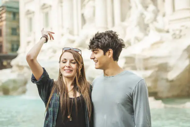 Flipping a coin in Trevi fountain