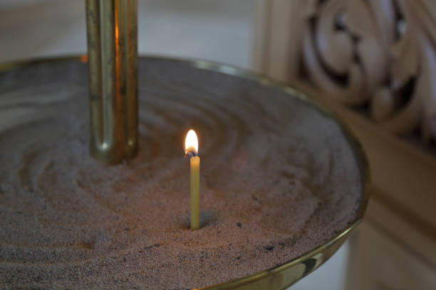 istock Burning candle in a church 1058877892