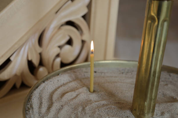 istock Burning candle in a church 1058877902