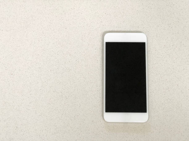 istock Smart phone on domestic kitchen bench top 1058879714
