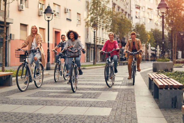 istock Friends Riding Bicycles In A City 1058880010