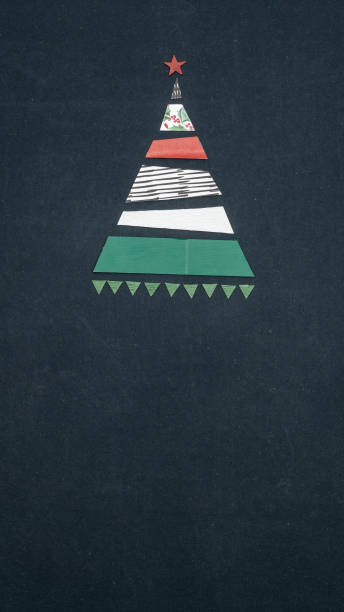 istock Text or logo empty copy space in vertical top view dark blackboard with paper gift wraps christmas tree pine design.Xmas winter holiday season party social media card background 1058880852