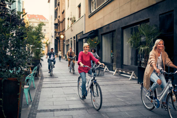 istock Friends Riding Bicycles In A City 1058881734